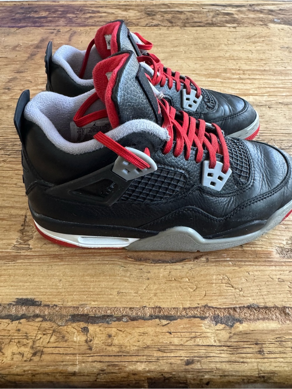 Nike Air Jordon 4 “Bred Reimagined” Black/Cement and Red (Big Boys size 4)